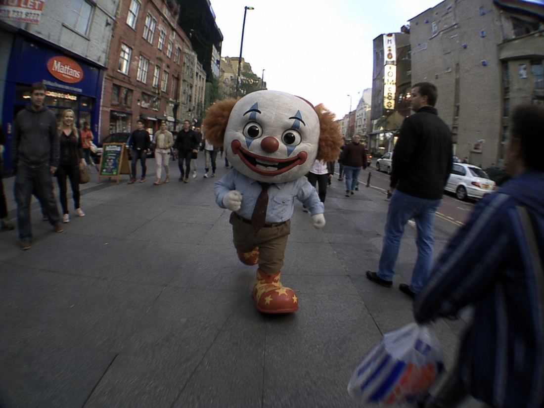 CLOWN running toward the camera